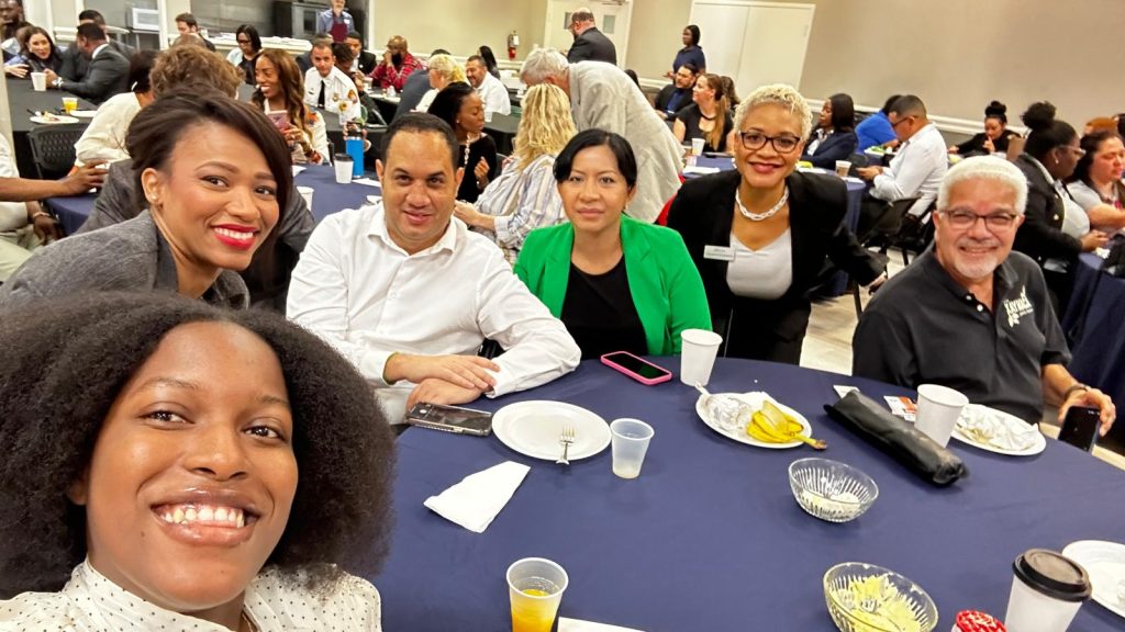 Selfie photo of group at breakfast
